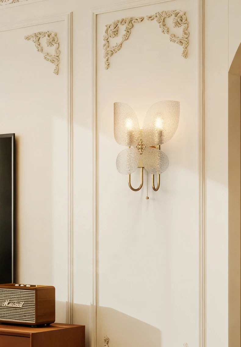 Decorative wall sconce on a wall with ornate detailing