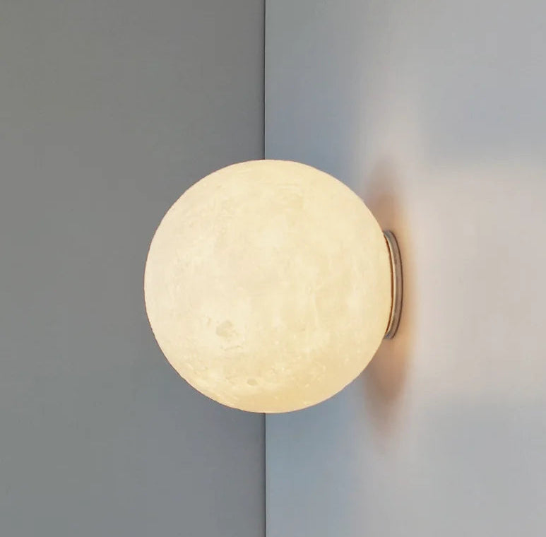Round wall light fixture on a gray wall
