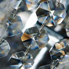 Close-up of clear crystal beads on a gray background