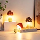 Three mushroom-shaped lamps on a surface with a 'Special Issue' book.