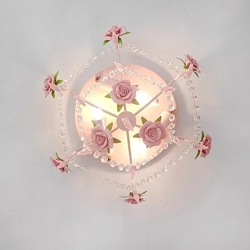 Overhead view of a floral-themed semi-flush ceiling light featuring pink roses and a circular arrangement of crystal beads.