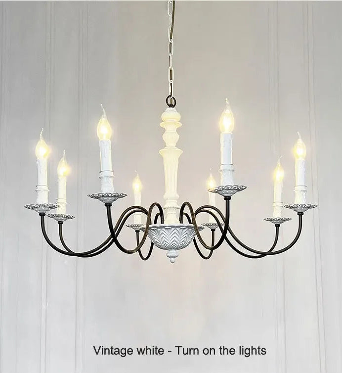 Vintage-style chandelier with multiple candle-like lights on a white background