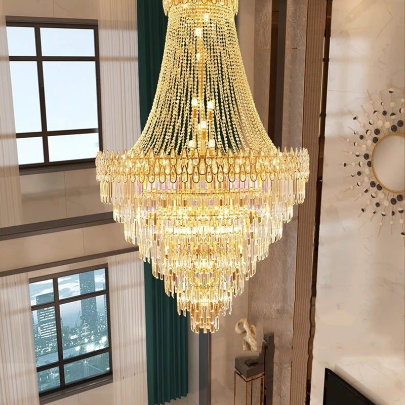 Luxurious chandelier hanging in a room with large windows and decorative elements.