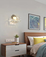 Modern bedroom with wooden nightstand, bed, and wall art.