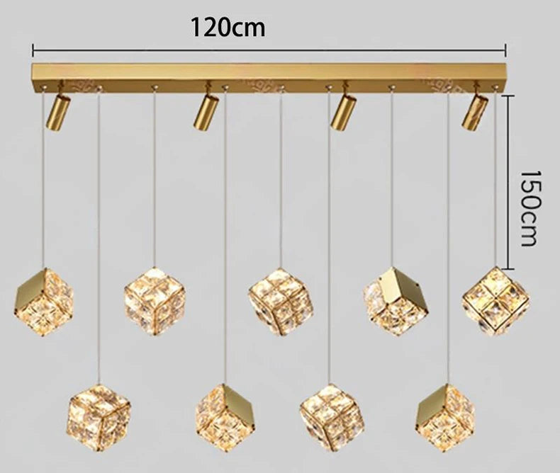 Gold pendant light fixture with crystal-like shades and measurement labels on a gray background
