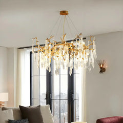 Gold chandelier with crystal accents in a living room setting