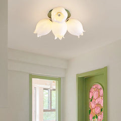 Close-up of the white orchid blossom flush mount ceiling light on a ceiling