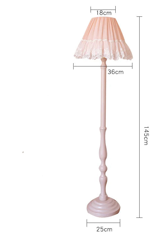 Pink floor lamp with lace shade and dimensions on a white background