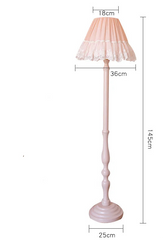Pink floor lamp with lace shade and dimensions on a white background