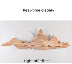 Wooden wall art with mountain design on a white background