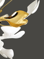 Decorative item with gold and white elements on a dark background