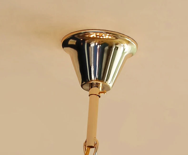 Gold bell on a beige background