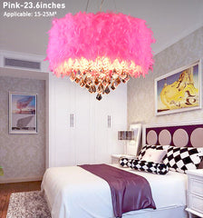 Pink feathered chandelier in a bedroom setting with a bed and wall art.