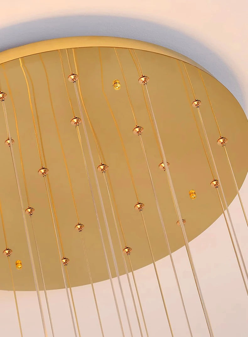 Gold ceiling light fixture with hanging bulbs on a white background