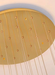 Gold ceiling light fixture with hanging bulbs on a white background