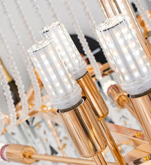 Close-up of a chandelier with gold and clear glass elements.