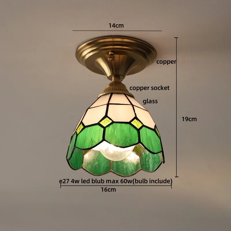 Ceiling light fixture with green stained glass shade and measurements on a neutral background