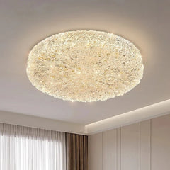 View of a gold resin textured flush mount ceiling light from an angle
