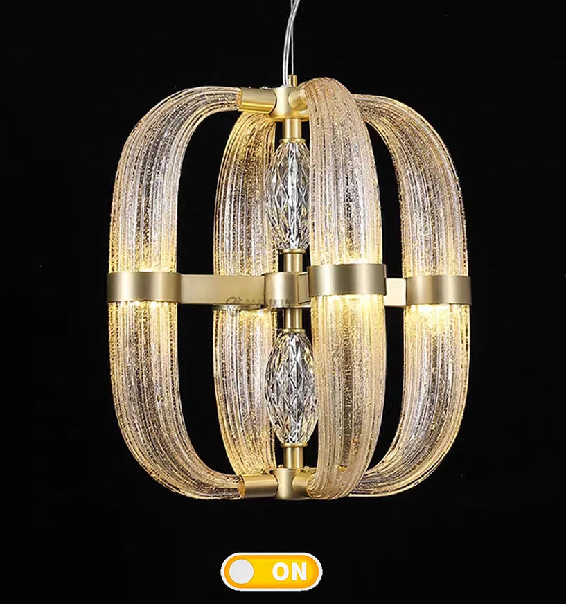 Gold and glass pendant light fixture on a black background with an 'On' indicator.