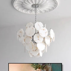 Side view of a gold and white faux alabaster marble disc chandelier with a polished chrome frame, mounted on a white ceiling.