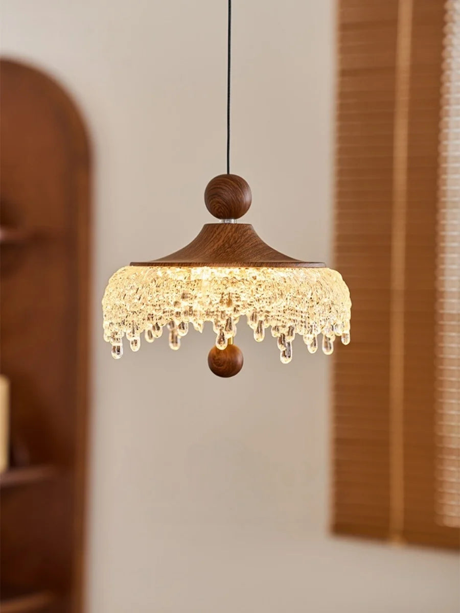 Wooden pendant light with crystal accents in a room setting