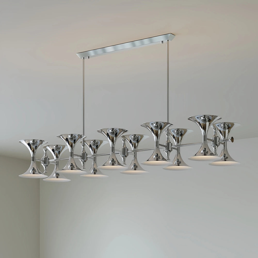 Close-up of the chrome chandelier's horn-shaped shades and polished finish
