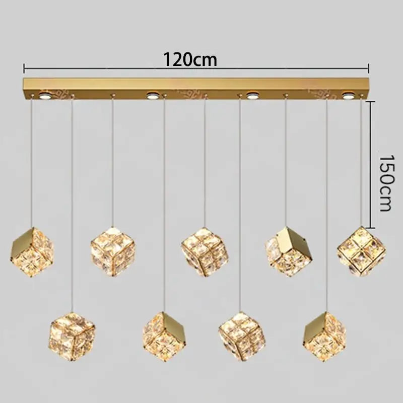 Gold pendant light fixture with crystal-like shades and measurements on a gray background