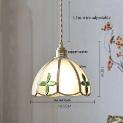 Pendant light with decorative glass shade, measurements indicated.