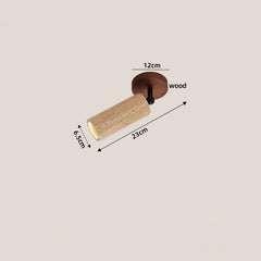 Wooden handle with measurements on a beige background