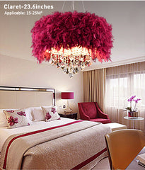Pink feathered chandelier in a bedroom setting