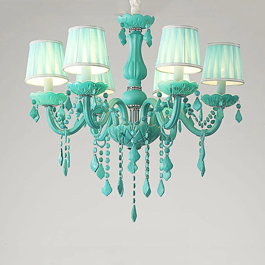 A cyan-colored crystal chandelier with fabric shades and teardrop crystal accents, shown against a white background.