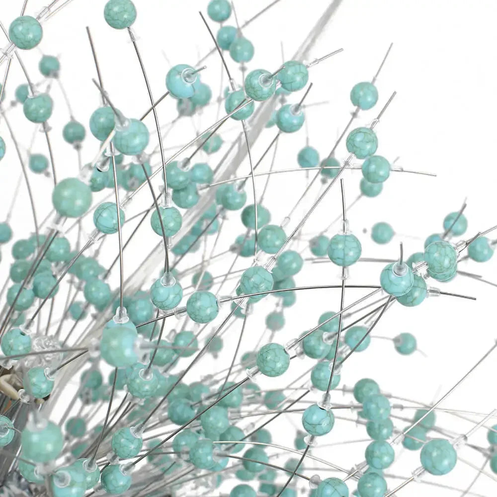 Turquoise berries on white stems against a white background
