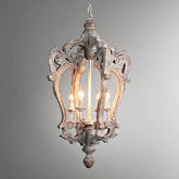Decorative pendant light with intricate design on a gray background