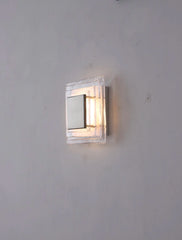 Square wall light fixture on a plain wall