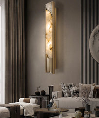 Modern wall sconce in a living room setting with a sofa and decor.