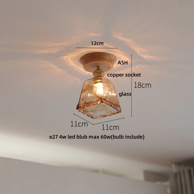 Ceiling light fixture with measurements labeled on a white ceiling.