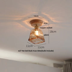 Ceiling light fixture with measurements labeled on a white ceiling.