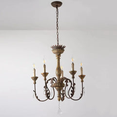 Vintage-style chandelier with five candle-like lights on a plain background