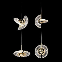 Set of four modern pendant lights with gold and clear design on a black background