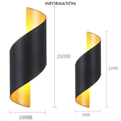 Black and gold wall sconce with dimensions on a white background