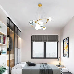 Modern bedroom with a ceiling light fixture, bed, and window.