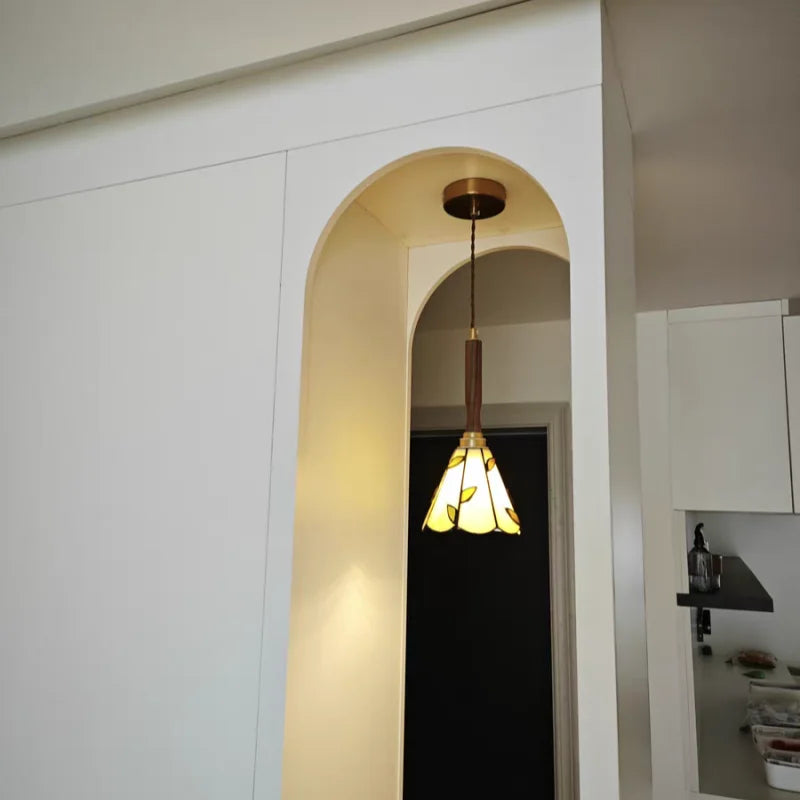 Pendant light fixture hanging in a modern interior setting