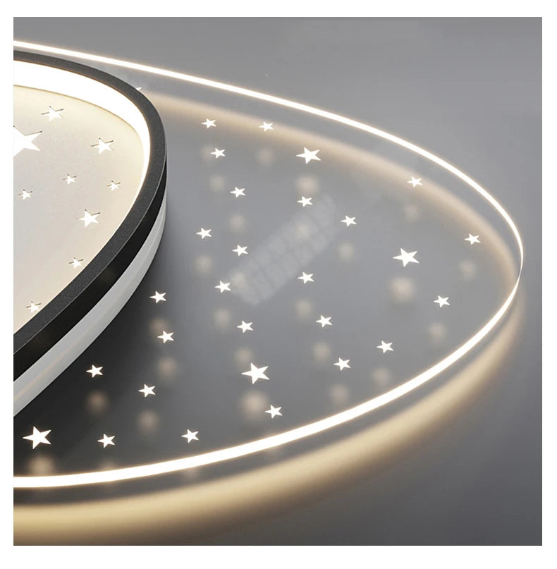 Ceiling light fixture with star patterns on a gray background