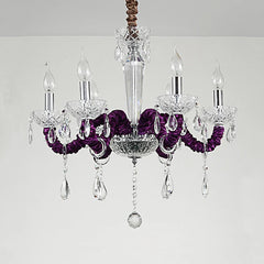 A regal 6-head chandelier in a deep purple hue, adorned with faceted crystals and a polished chrome central column.