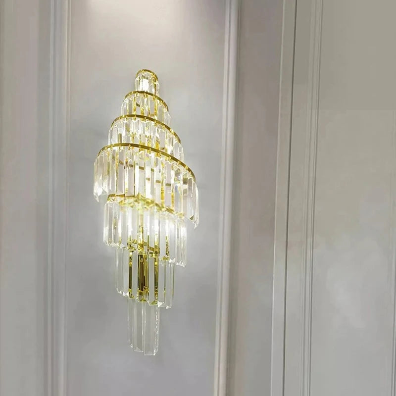 Side view of a gold crystal spiral wall sconce, emphasizing its length and the layered arrangement of its crystal elements.