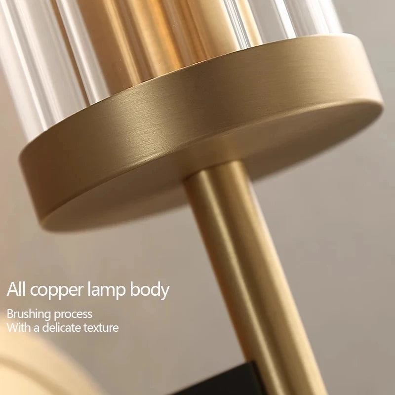 Close-up of a gold lamp body with text describing the brushing process.