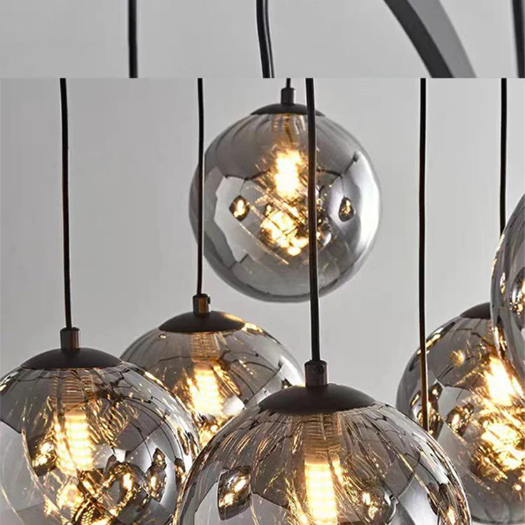 Chandelier with glass globe lights on a neutral background