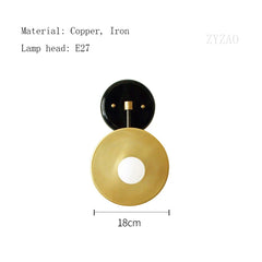 Wall-mounted lamp with black and gold design on a white background, featuring dimensions and material information.