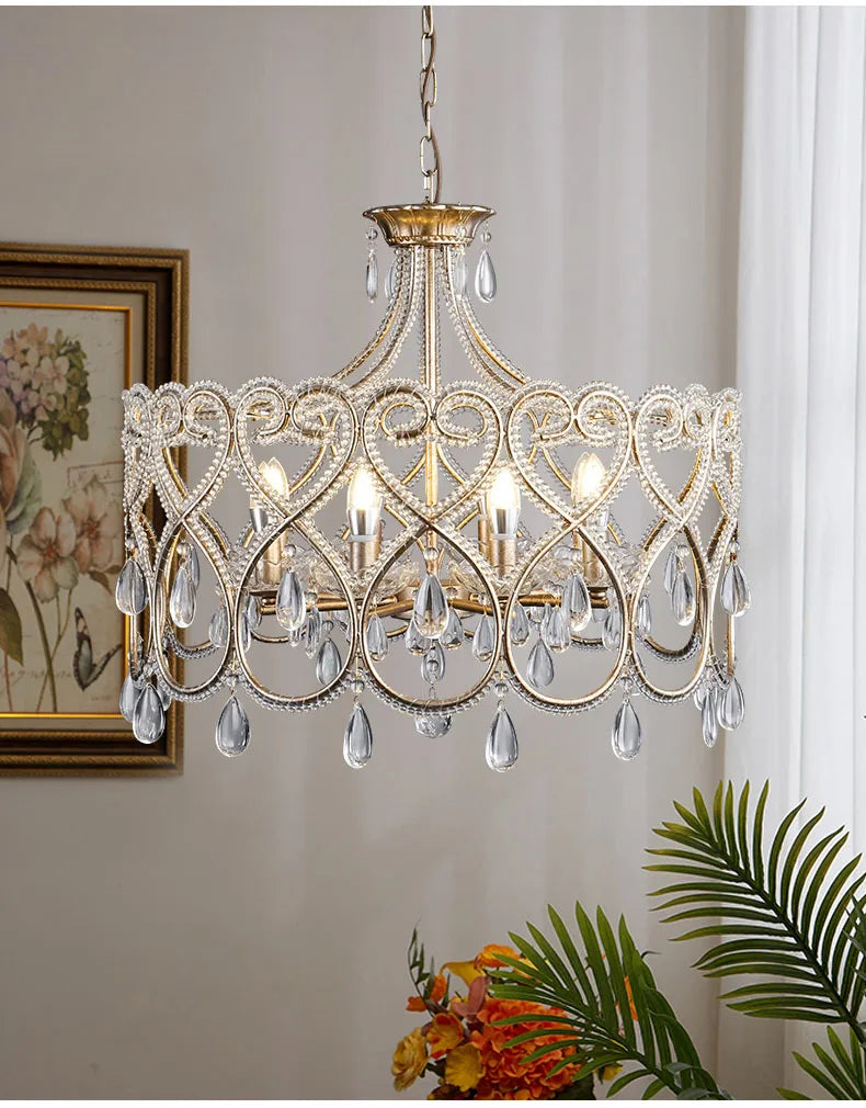 Decorative chandelier with crystal accents in a room setting.