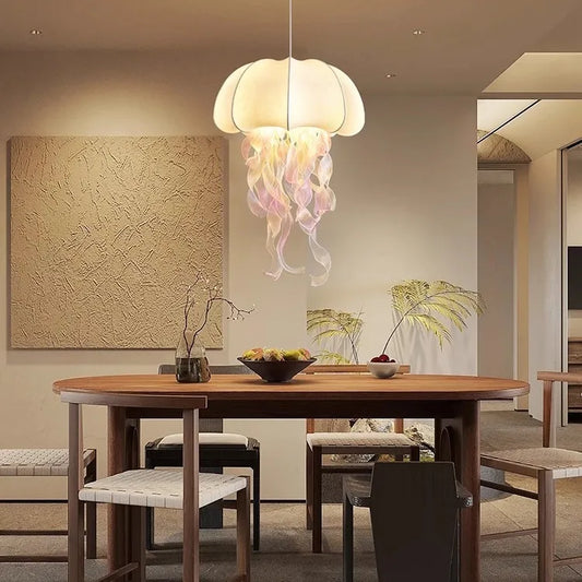 Dining room with a jellyfish-shaped pendant light hanging above a wooden table